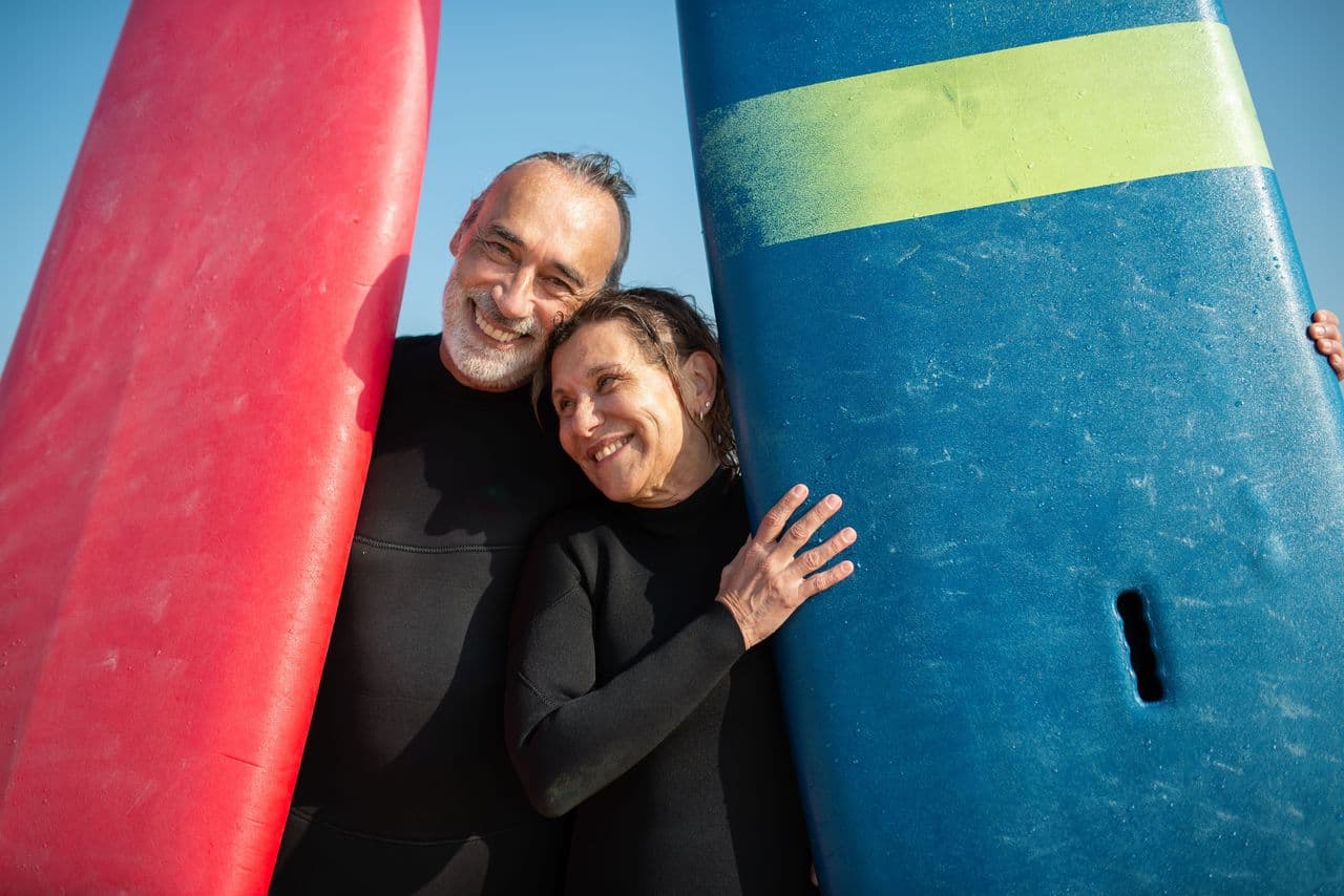 A retired couple surfing
